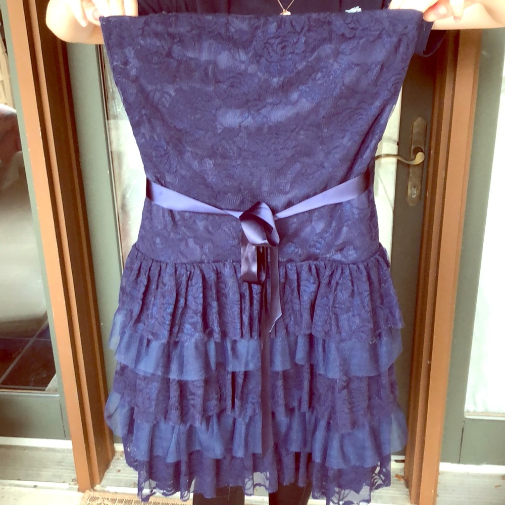 Shimmery navy blue lace, ruffled bottom dress.